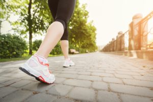Woman running on sunny day