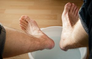 cooling feet in bucket of water